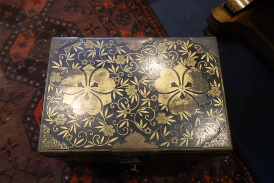 A Japanese black lacquer travelling chest, Meiji period, W.2ft 1in. D.1ft 5in. H.1ft 4in.